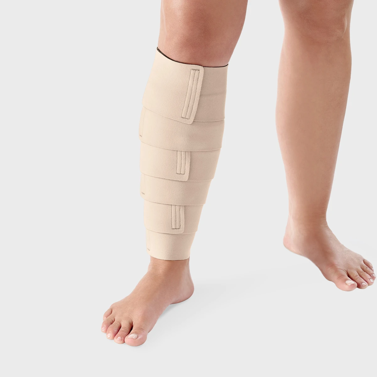 Beige L&R ReadyWrap calf wrap with overlapping adjustable straps